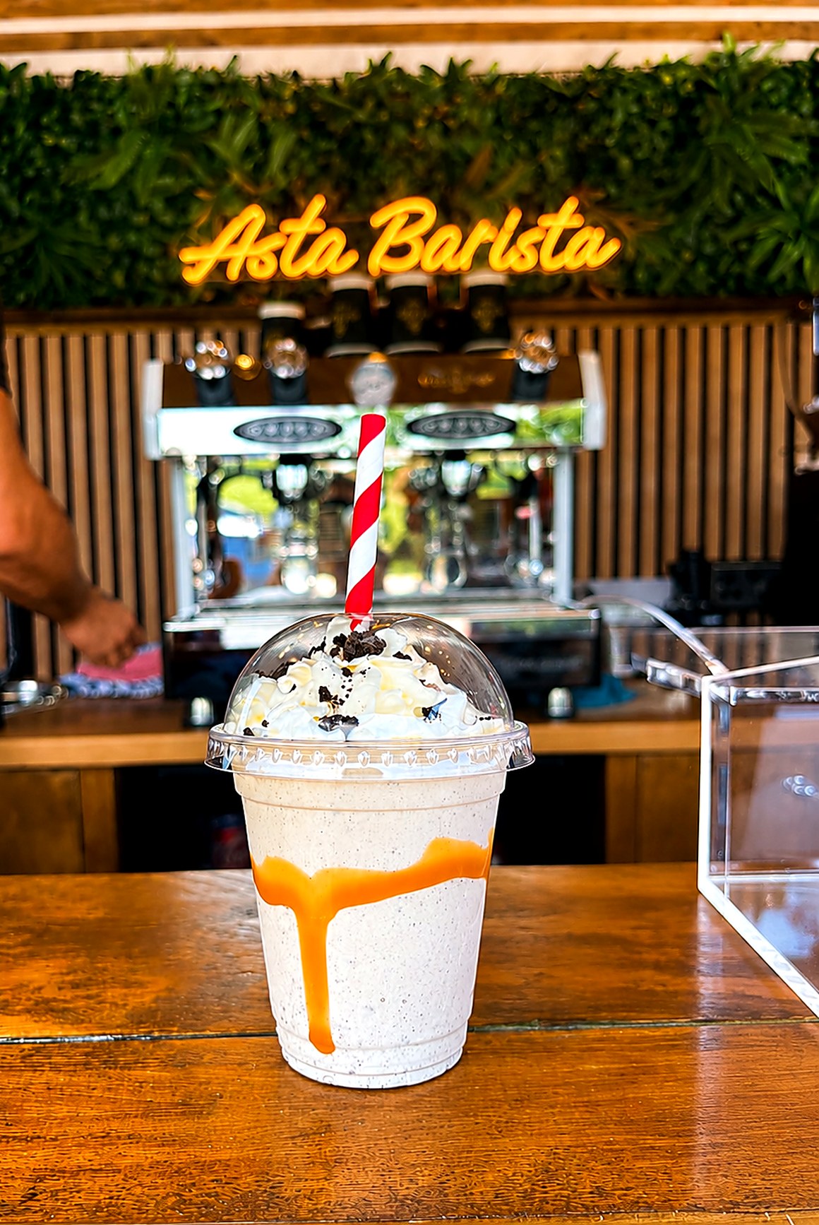 Milkshake with whipped cream inside the Asta Barista trailer